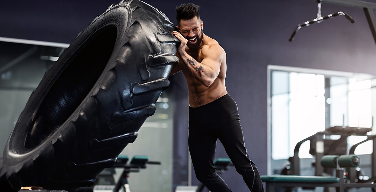 man-flipping-tire-during-gym-workout-2026-01-08-23-12-28-utc (1)